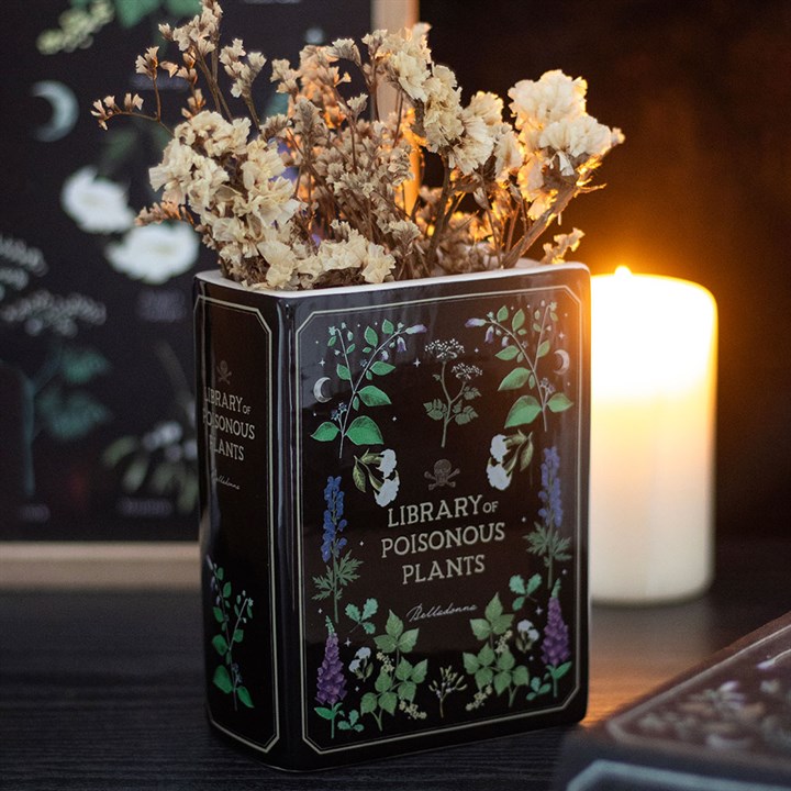 Vase in Form eines Buches über giftige Pflanzen