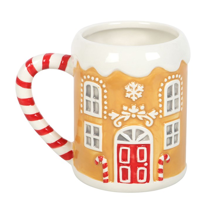 Tasse mit Zuckerstangen-Lebkuchenhaus