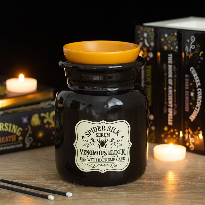 Ölbrenner und Wachswärmer in Form einer Fläschchenflasche mit Spinnenseidenserum