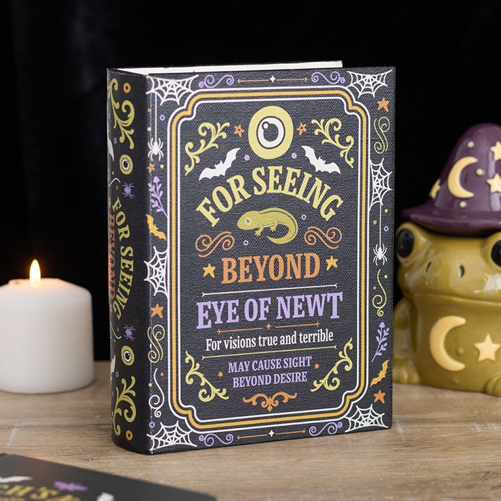 Aufbewahrungsbox in Form eines Zauberbuchs mit dem Titel „Eye of Newt“
