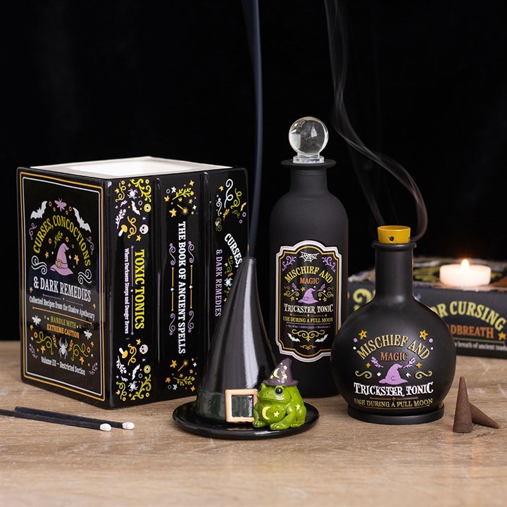 Ölbrenner und Wachserhitzer in Form eines Hexenapothekenbuchs