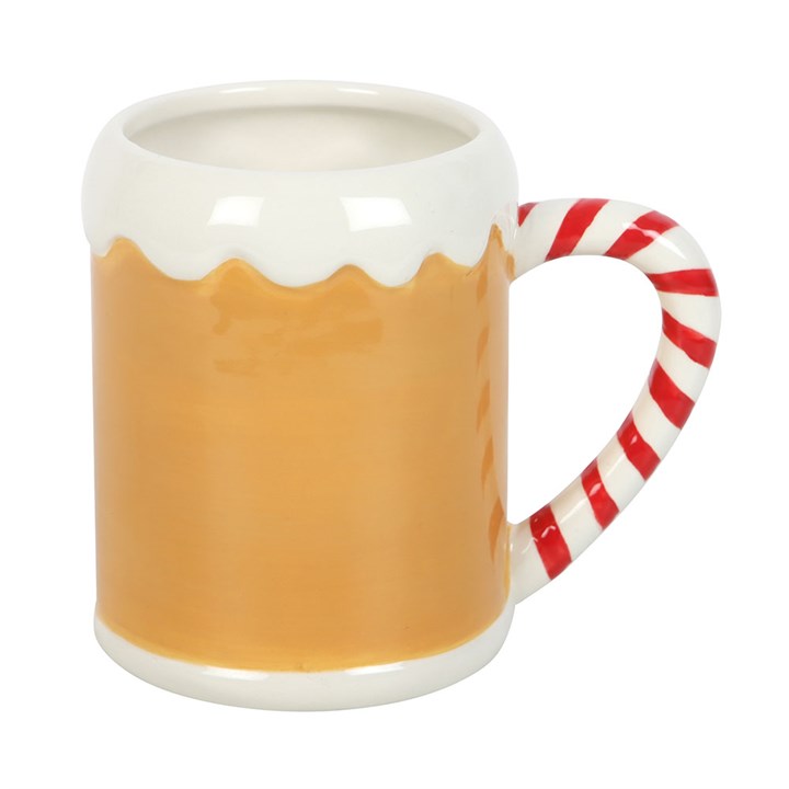 Tasse mit Zuckerstangen-Lebkuchenhaus